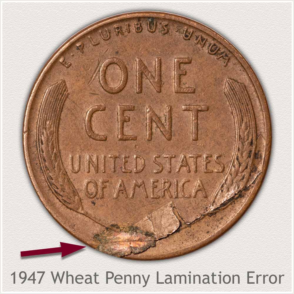 1947 wheat penny lamination error showing peeling surface layer and delaminated area of copper planchet